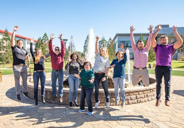 Image of the Biology at LCLS team jumping in the air