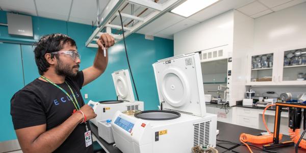 Image of postdoctoral research fellow Nanda Gowtham Aduri seen working inside ASC Lab Room 2128.