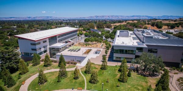Image of SLAC's main quad with Stanford University campus in the distance