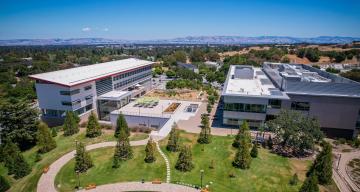 Image of SLAC's main quad with Stanford University campus in the distance